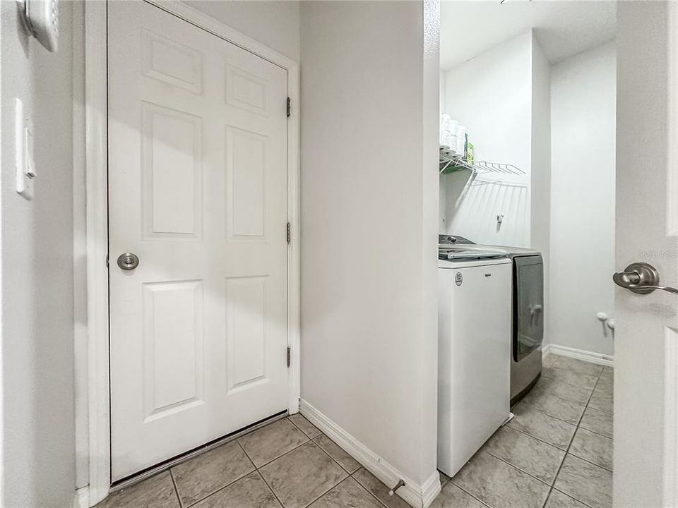 Private garage entry and laundry room.
