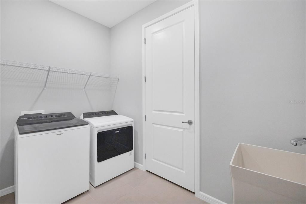 Over-sized laundry room with laundry sink