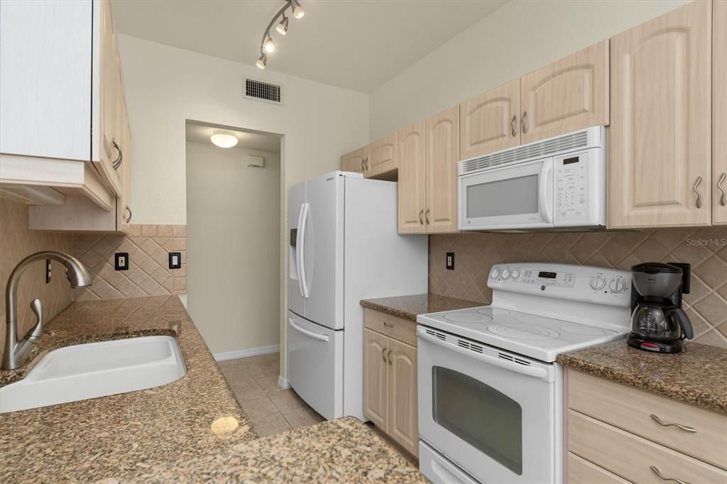 Large Kitchen with granite counters and ample storage 602 Casa Del Lago, Venice, FL, 34292