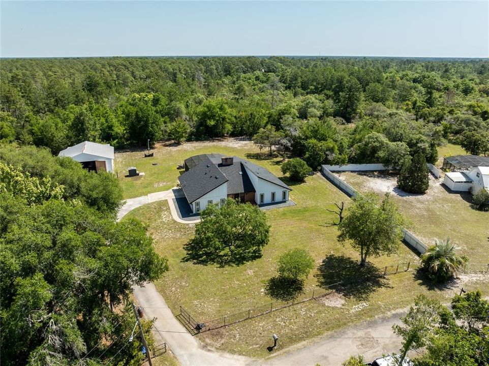 3/2 remodeled pool home with huge metal building on 2.5 fenced acres.
