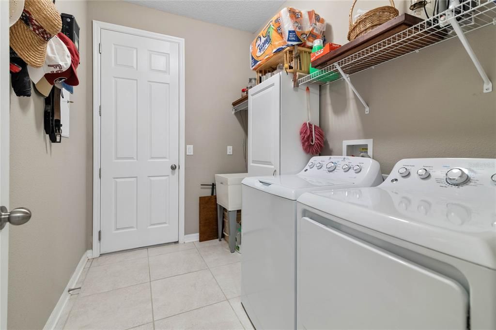 Inside Laundry with access to the Garage.