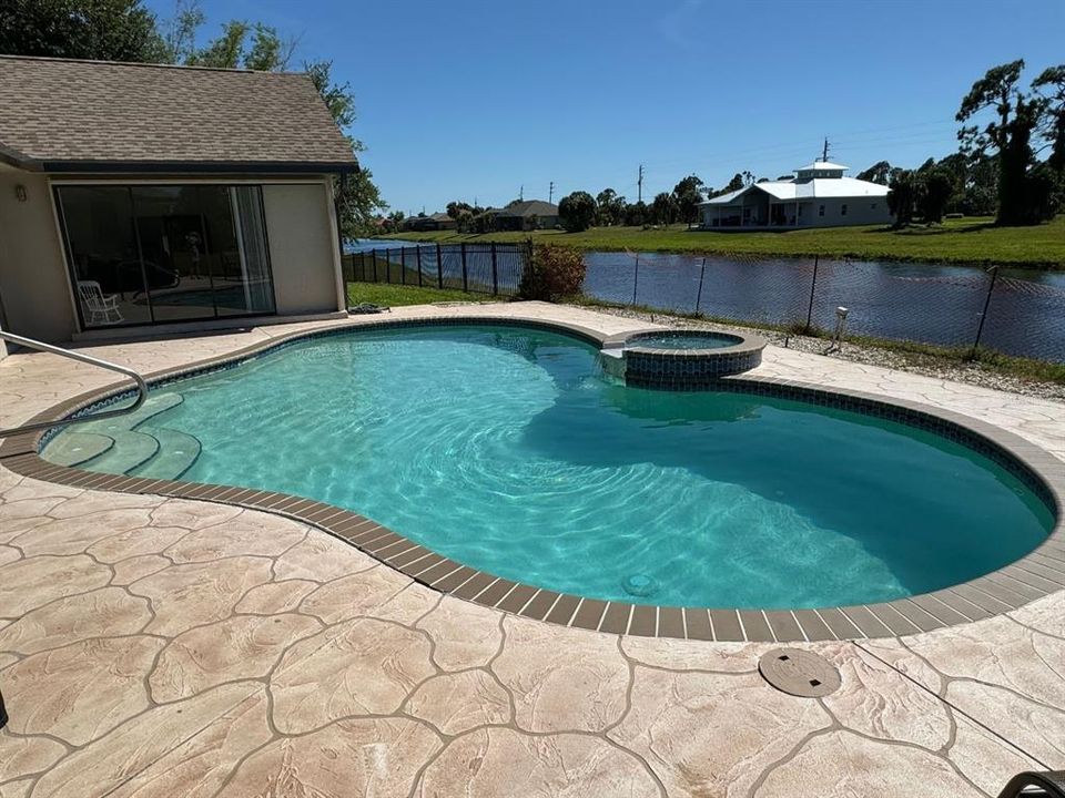 View of pool and hot tub