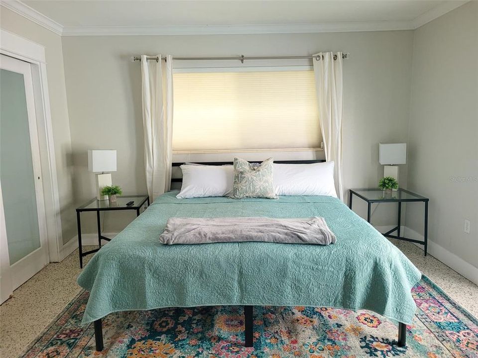 The large King guest bedroom is just between the bathroom and the Queen guest bedroom. This bedroom can easily fit additional furnishings if needed. This bedroom also comes with direct access to the pool area