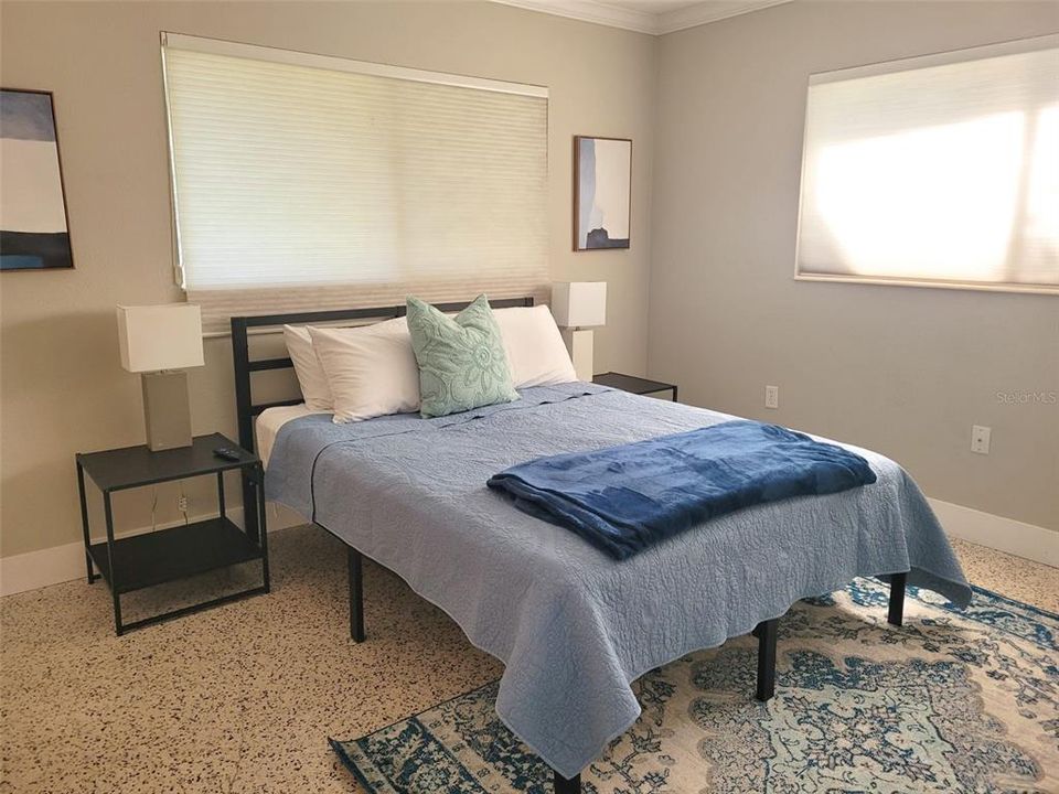 The queen guest bedroom is located down the hall from the front living room area. This bedroom also features a built in closet large enough for fitting all your belongings. You can easily get a small dresser in this room as well