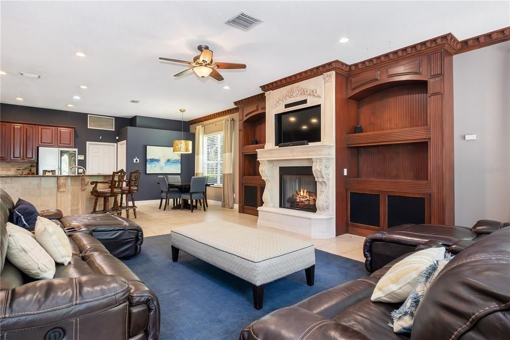 Family Room with fireplace and built in shelves / entertainment center