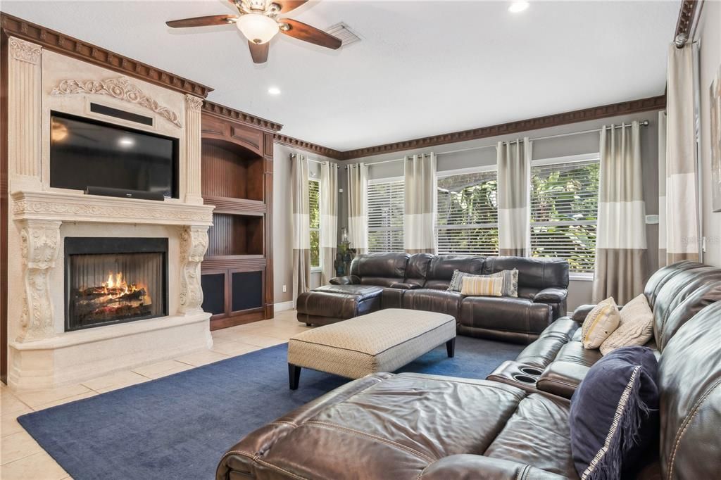 Family Room with gas fireplace and built in shelves / entertainment center