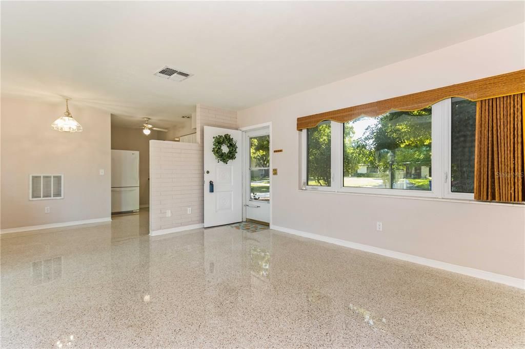 Light and bright with gleaming, polished terrazzo flooring throughout
