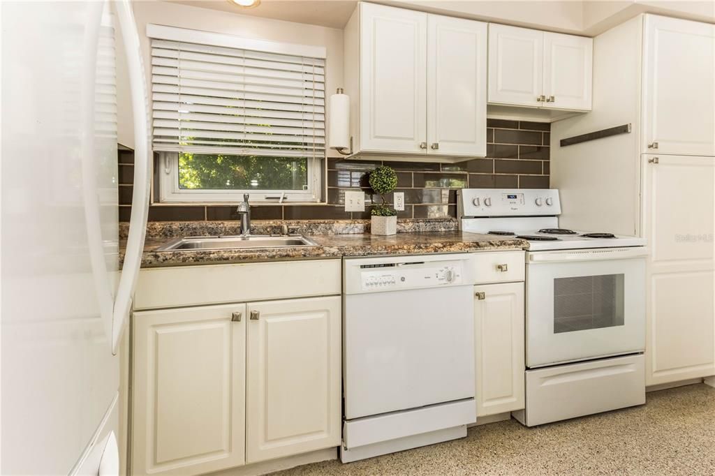 Open kitchen also with beautiful terrazzo flooring.