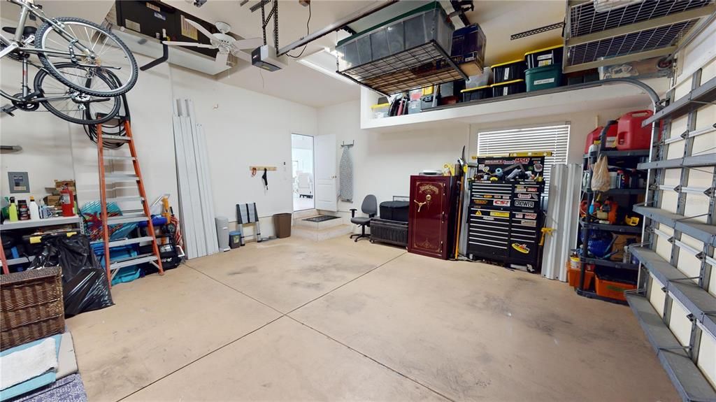 Large 2 car garage with extensive storage