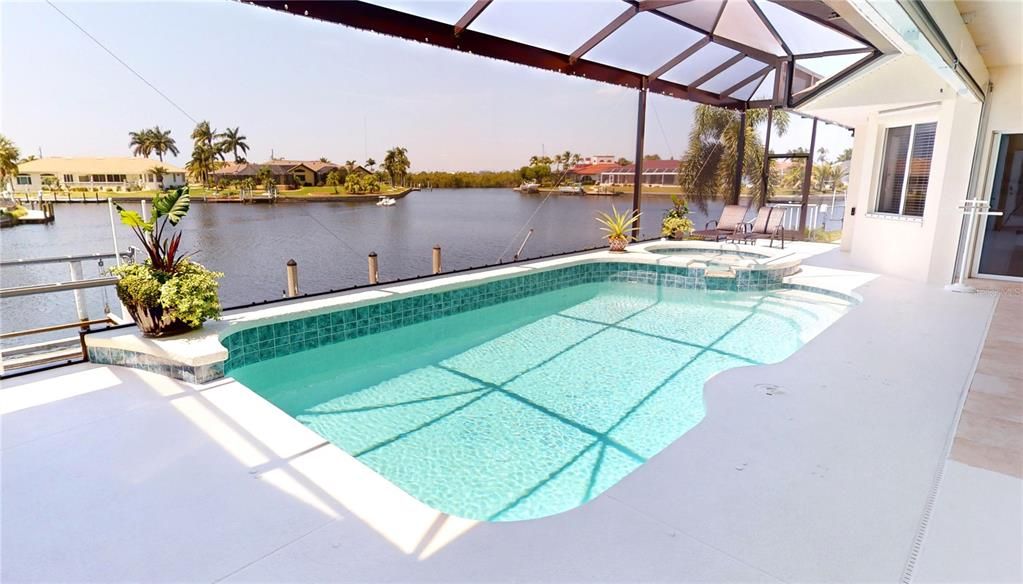 Heated pool and spa with panoramic views of waterway