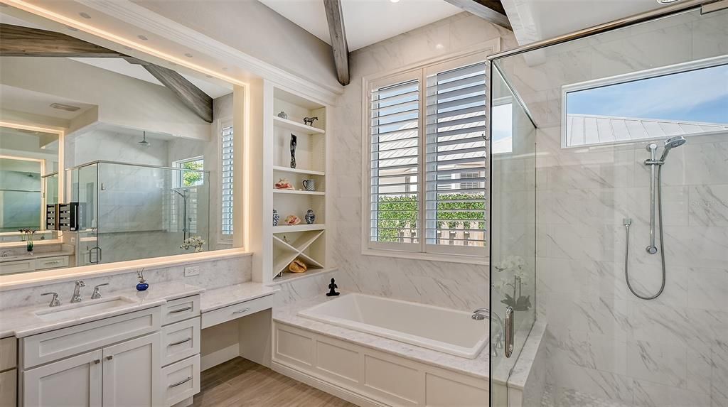 The tile and glass en-suite bath is a welcome respite after a long day
