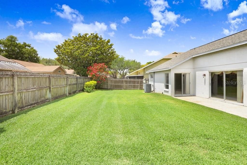 Oh my goodness, this backyard is huge, completely fenced, and well-maintained!  Perfect for a pool or even just for the kids or fur babies to run and play!
