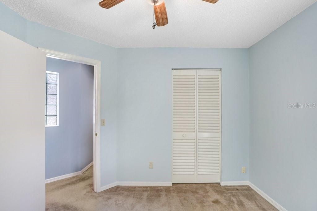 The 3rd bedroom features a lighted ceiling fan and a good-sized closet.
