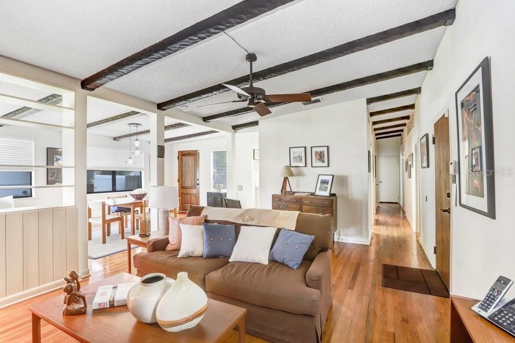Beautiful wood floors and eye-catching beams in the Living Room.