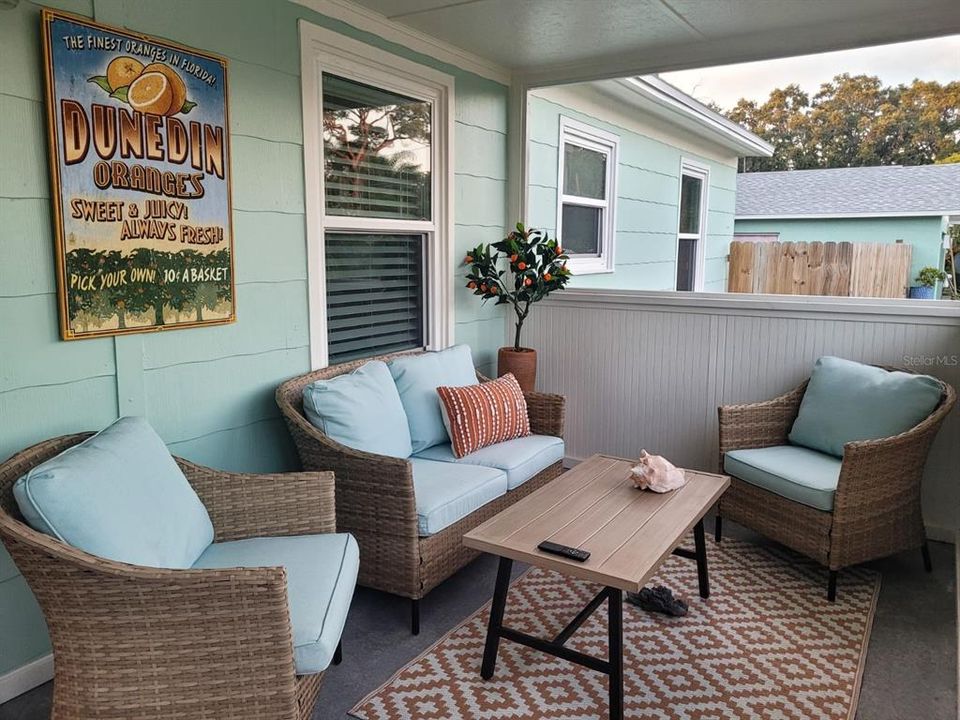 The screened in front porch to our sweet bungalow. You can also find a small hand built bistro out here which is perfect for enjoying small meals