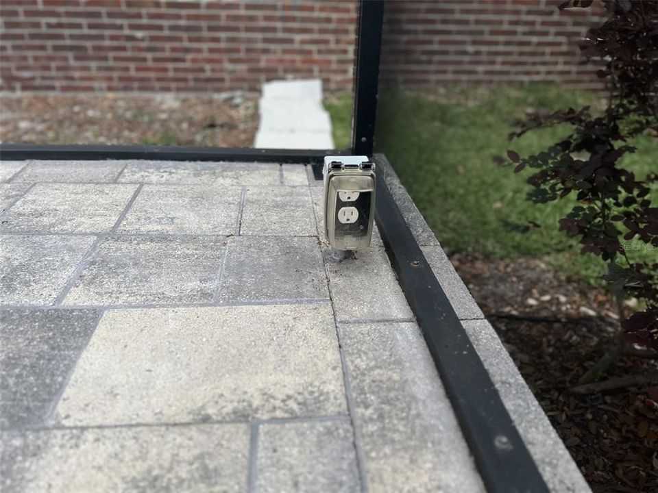 One of 2 additional electrical outlets on patio