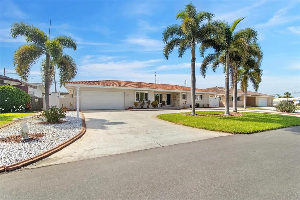 Solid block construction, 2 car garage, whole house generator, circular drive, tropical paradise.  Come on!