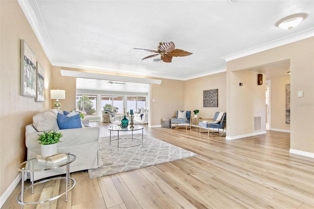 Spacious great room provides an open concept that seamlessly leads into the sunroom.... and then the pool!!