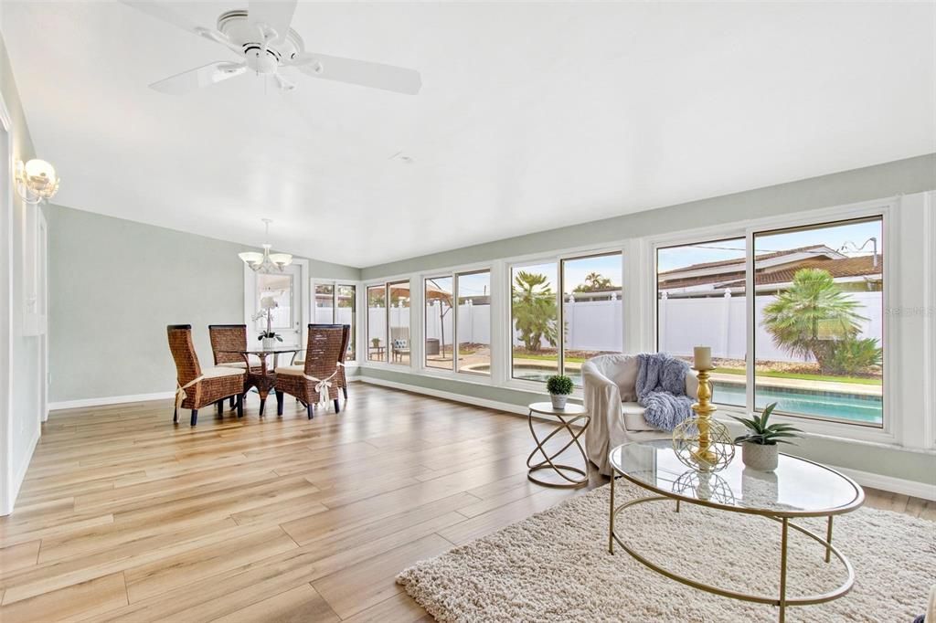 Sunroom has space for a breakfast eating space overlooking the pool.  The door leads to the covered oudoor entertaining area and your resort style pool.  You can't get a better home for entertaining!