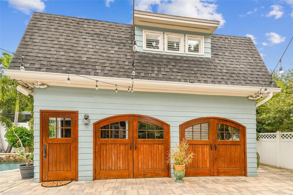 Guest quarters with custom, red mahogany garage doors!