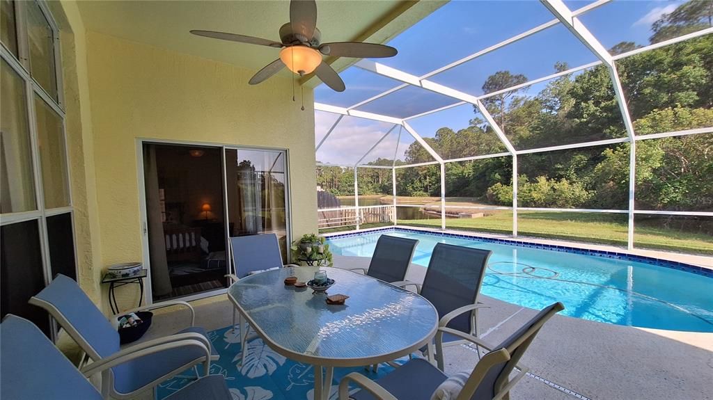 COVERED PORCH OVERLOOKING SCREENED POOL