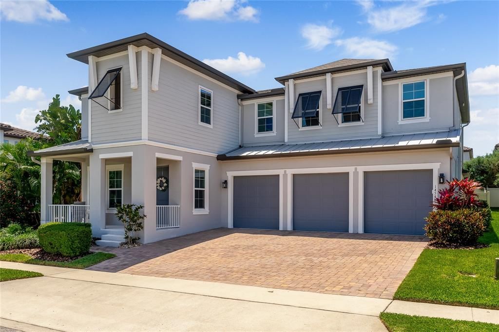 Front view of the home with paver driveway.