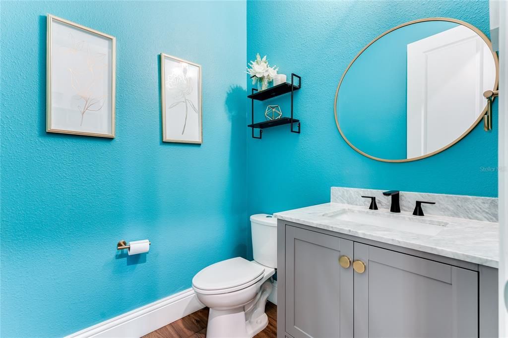 The bright and fun guest powder room on the first floor.