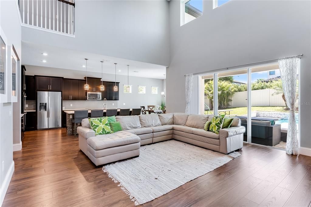 Family room and kitchen have stellar views of the pool and backyard.