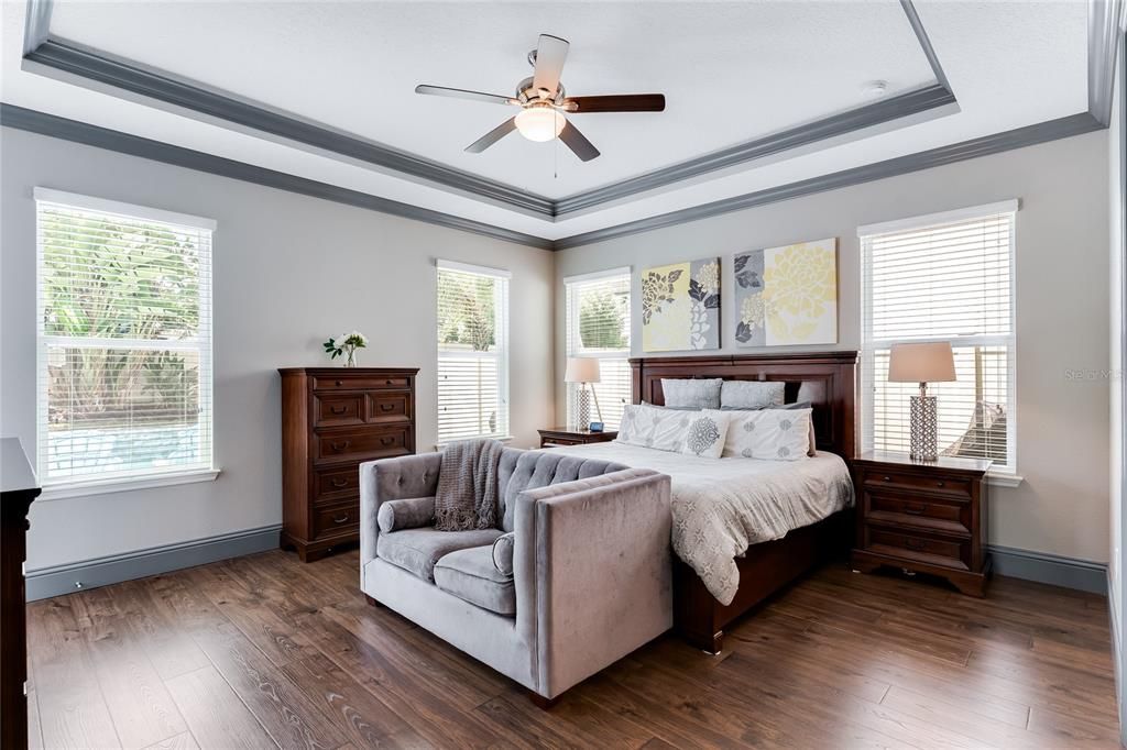 Soothing vibes in the master bedroom with lots of outdoor light.
