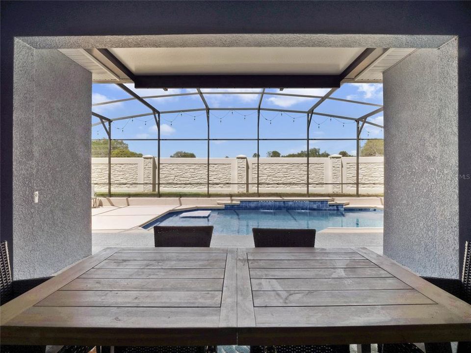 covered patio with view to the pool