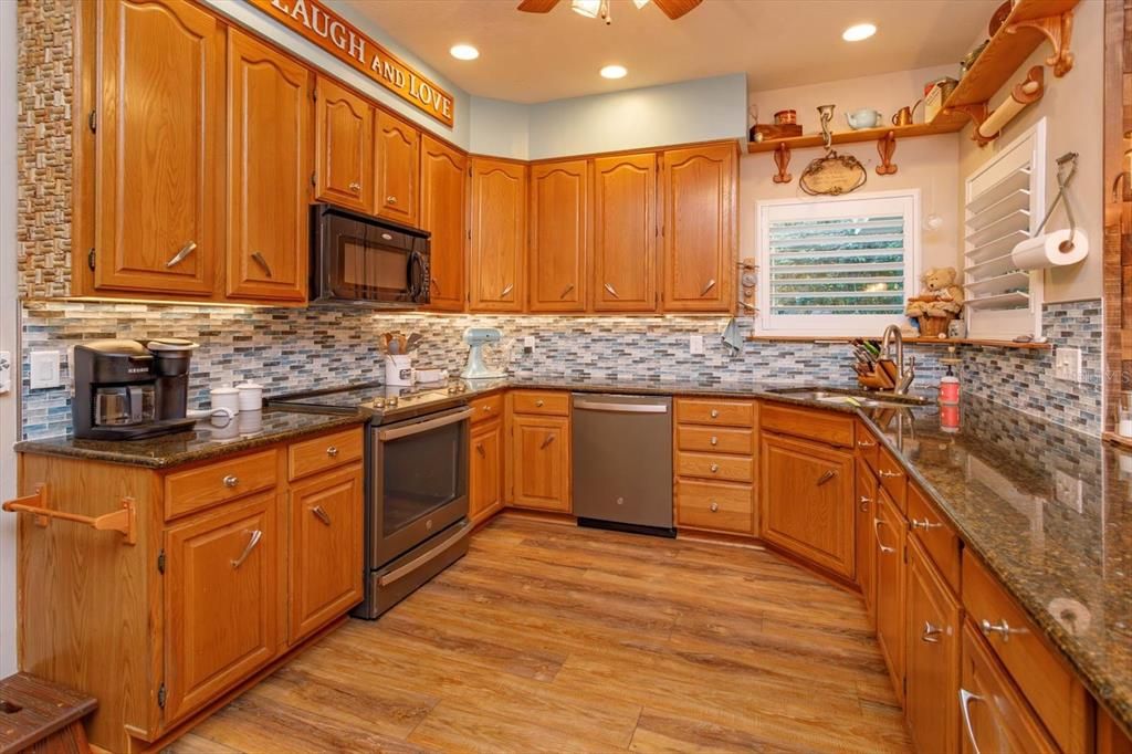 Granite countertops and stainless appliances in your open kitchen