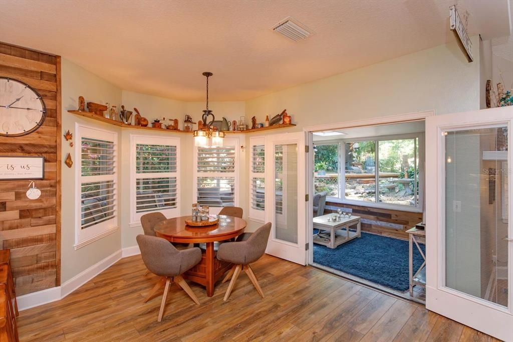 Casual dining area leads to the glassed in rear lanai