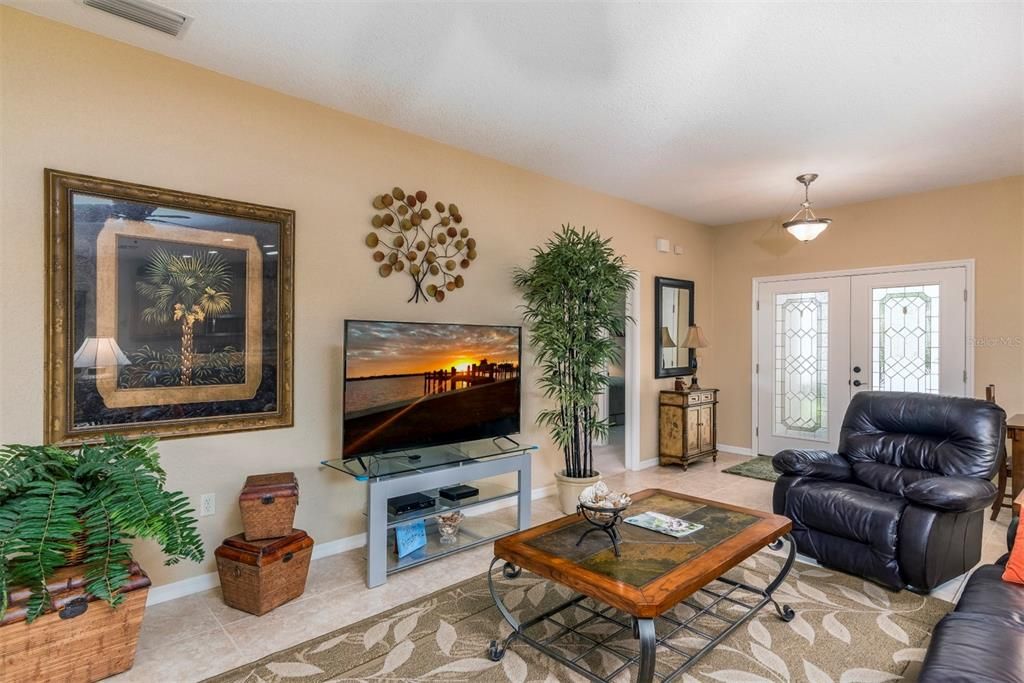 The living room is the center of this homes open floor plan.