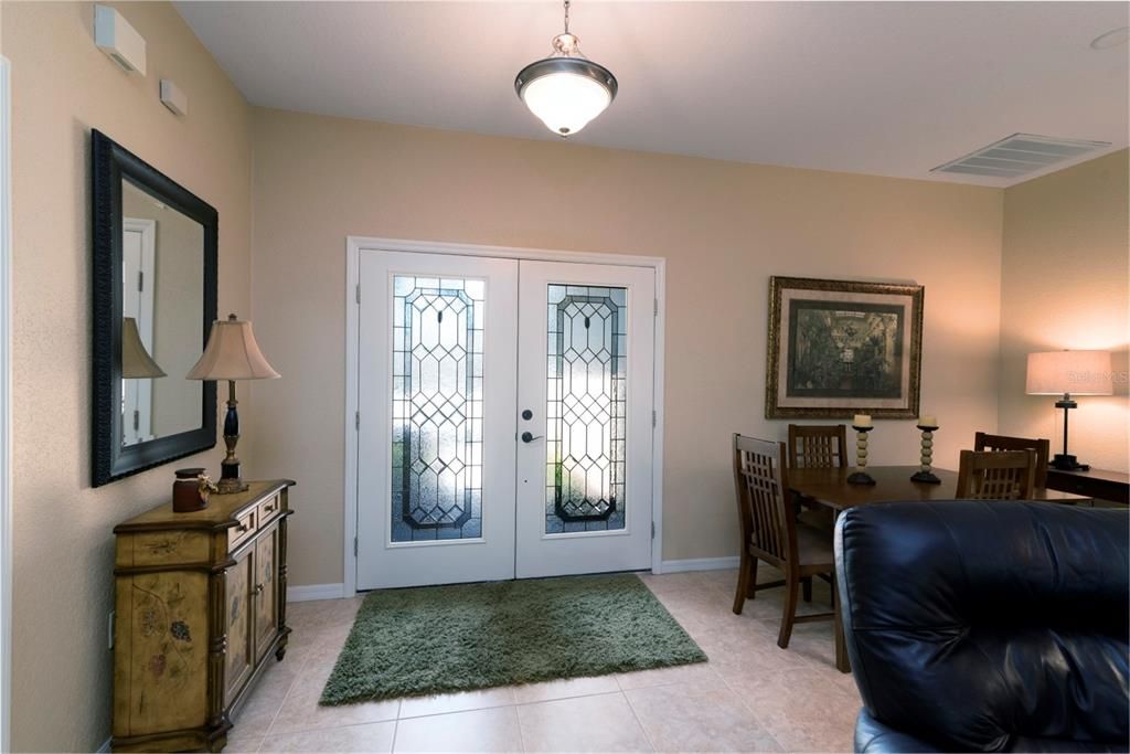 The leaded glass double front door provides a warm welcome and also natural light.