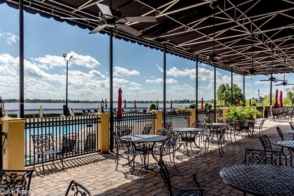 The outdoor seating for the Charm City Grill has a great view of the outdoor pool and Lake Ashton itself.