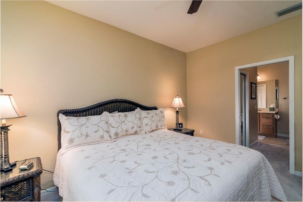 The master suite has a large bedroom and 2 walk in closets in the hallway to the master bath.