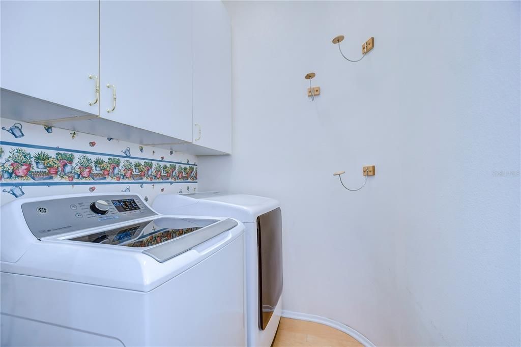 Laundry room with large upgraded cabinets