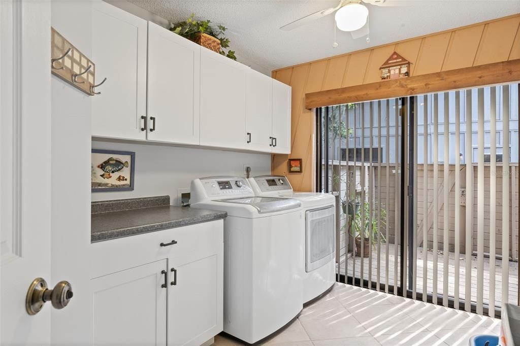 Deck beyond the Sliding Doors accesses the side yard and Shed.