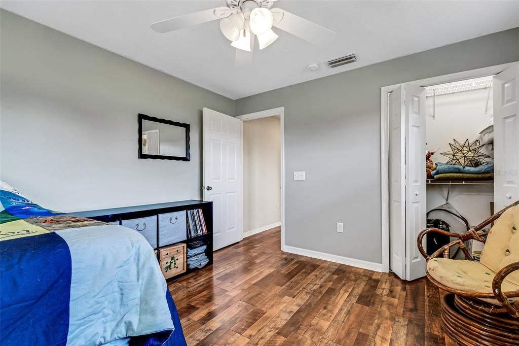 With wood laminate flooring and built-in closets