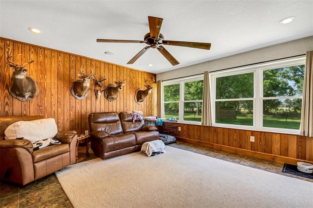 The family room or den invokes the feel of a mountain cabin.