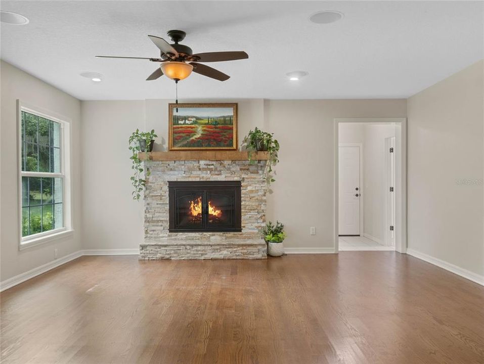 Family room with wood burning fireplace