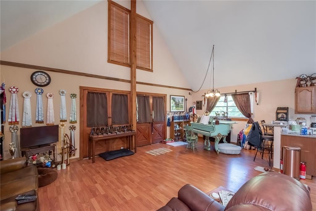 High vaulted ceilings overlooking open living/dining areas