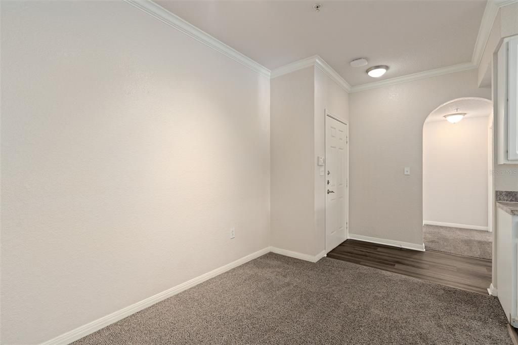 View from front door to kitchen/dining area and hallway to living room