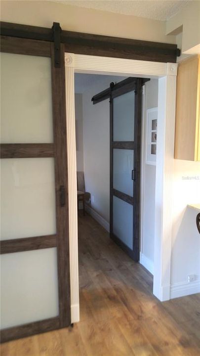 Barn Door Leading To Primary Bedroom