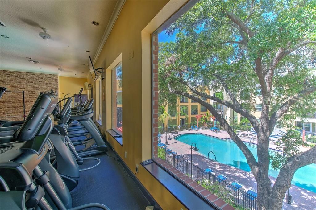Fitness Center Overlooks Resort Style Pool