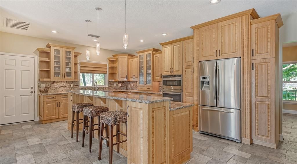 The kitchen has been completely redone and now features stunning bamboo cabinets and stainless steel appliances.