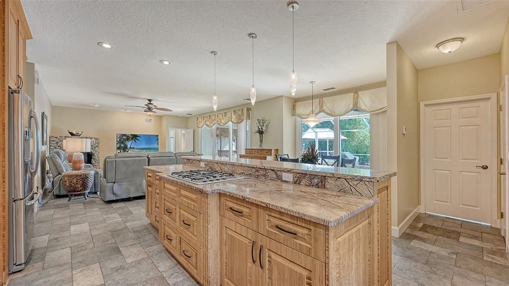 This gorgeous kitchen was recently added and it has everything you could ever want to create culinary masterpieces! Through the closed door you will find an ample sized laundry room.