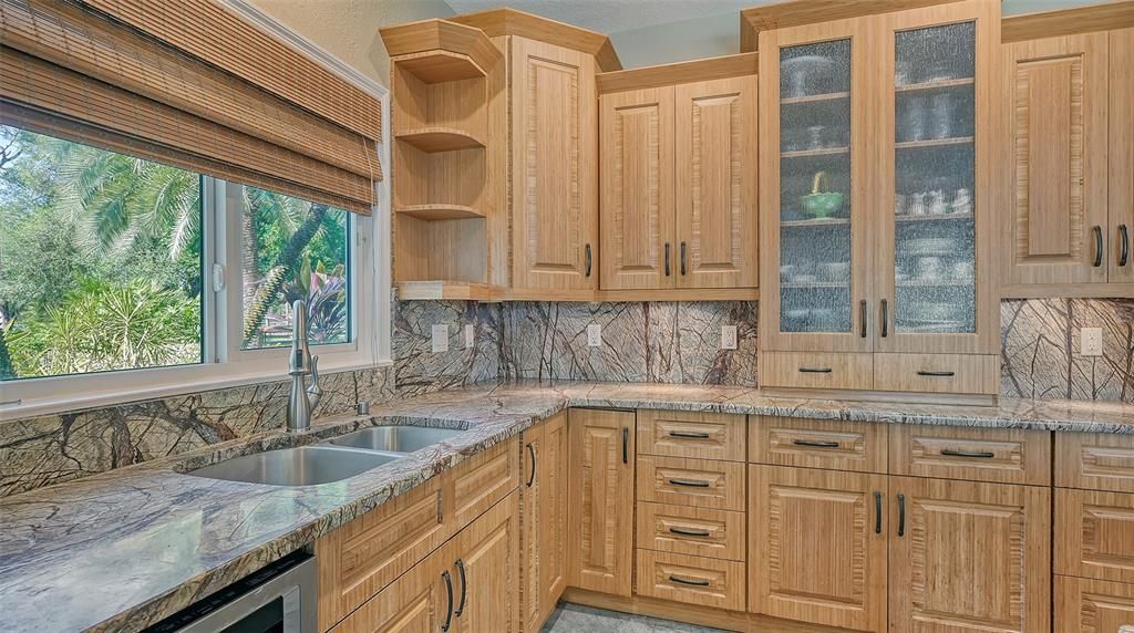 Beautiful backsplash, gorgeous cabinets.