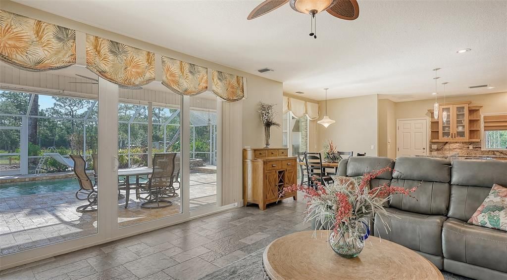The Family Room overlooks the phenomenal pool and outdoor entertainment area.