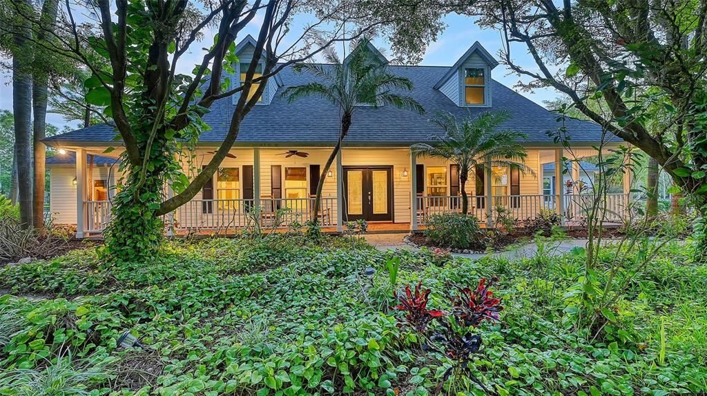 The home's lush landscaping is reminiscent of Selby Gardens.